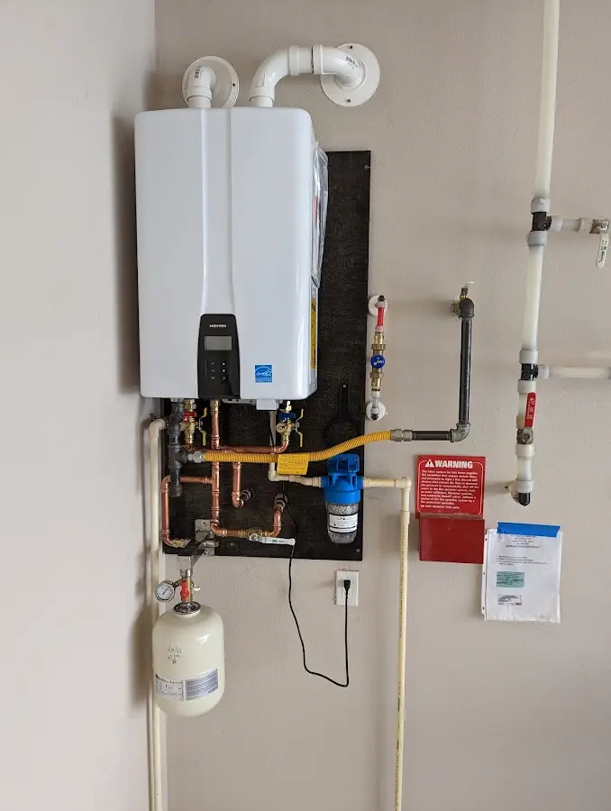 Professional plumber installing copper piping in a Dowagiac home